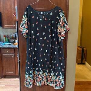 Beautiful floral dress with black background. It is from SHEIN and is a size 4XL